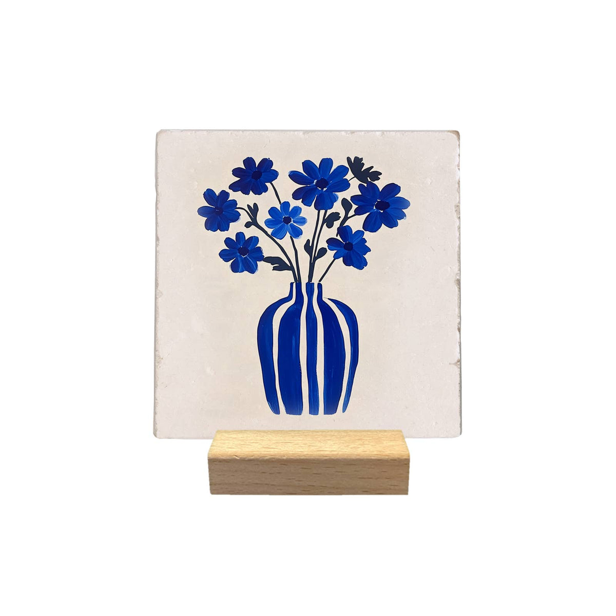 Blue Vase and Flowers decorative tile, with a blue bouquet on a light background, displayed on a small wooden stand against a white background.