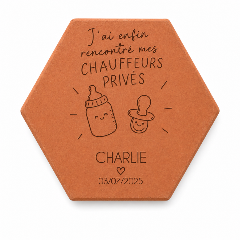 Personalised birth keepsake terracotta tile for Charlie, engraved with “Mes chauffeurs privés”, a baby bottle and a dummy, on a white background.
