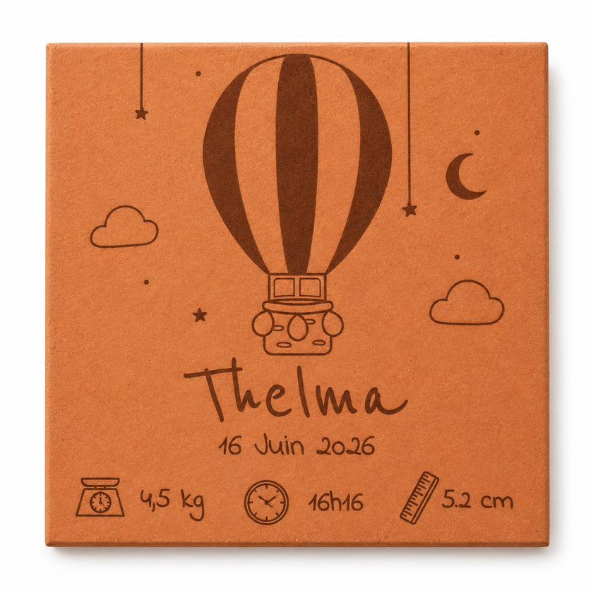 Terracotta tile with a hot-air balloon birth announcement design, including a name, date, weight, length and time — white background.
