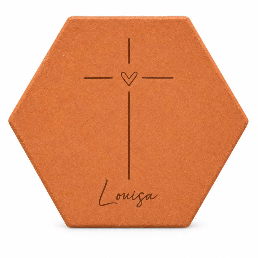 Personalised decorative tile Catholic cross with the name Louisa, staged in an church-inspired setting — white background view