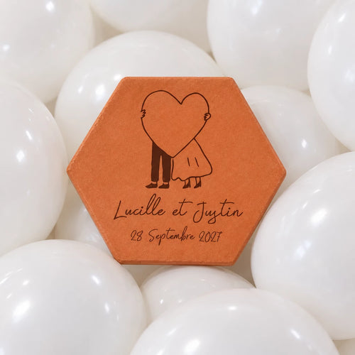 Hexagonal terracotta tile “Big Heart” on a bed of white balloons.